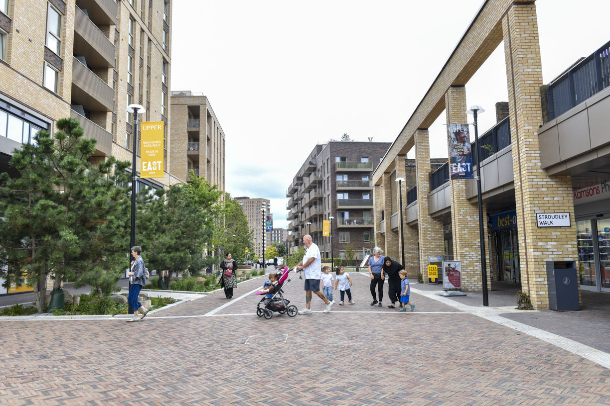 Families walking through the landscaped neighbourhood