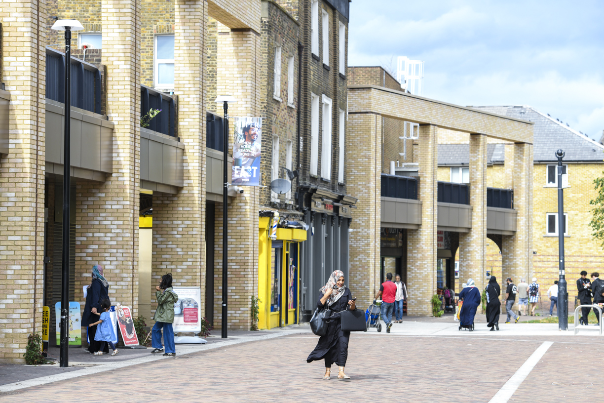 Neighbours walking past the local shops
