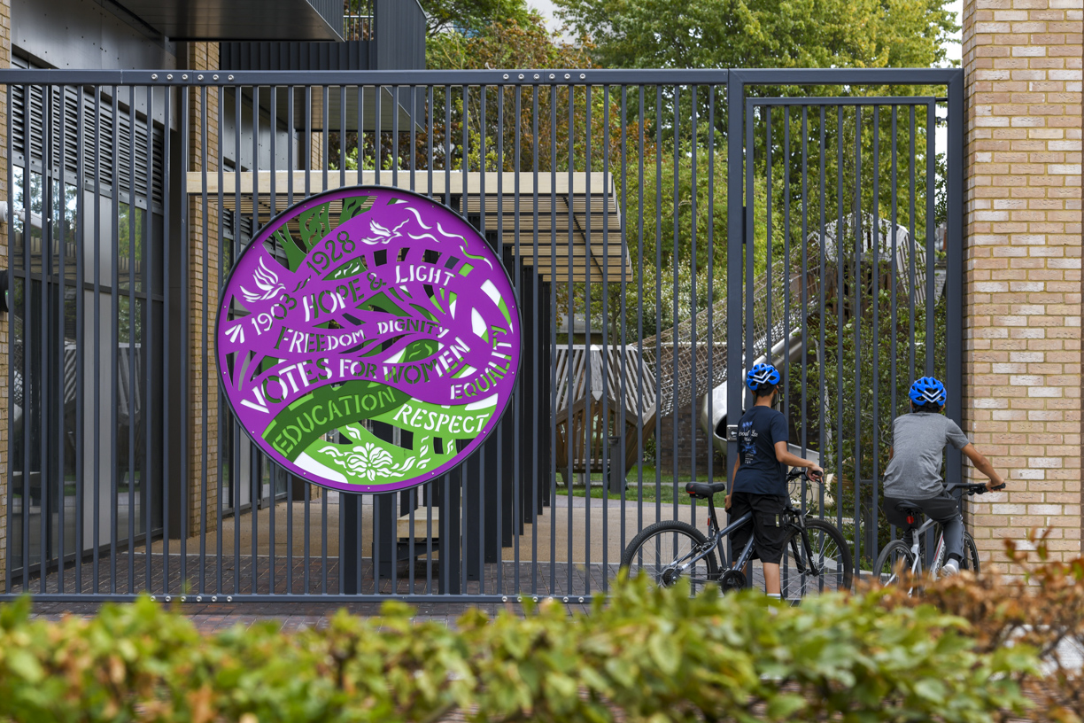 The 'Votes for Women' suffrage artwork on the gates at Stroudley Walk