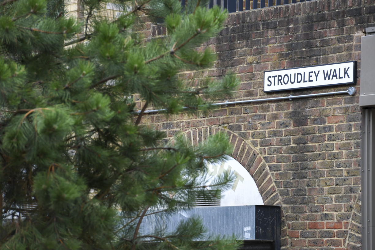 The Stroudley Walk street sign beside leafy trees