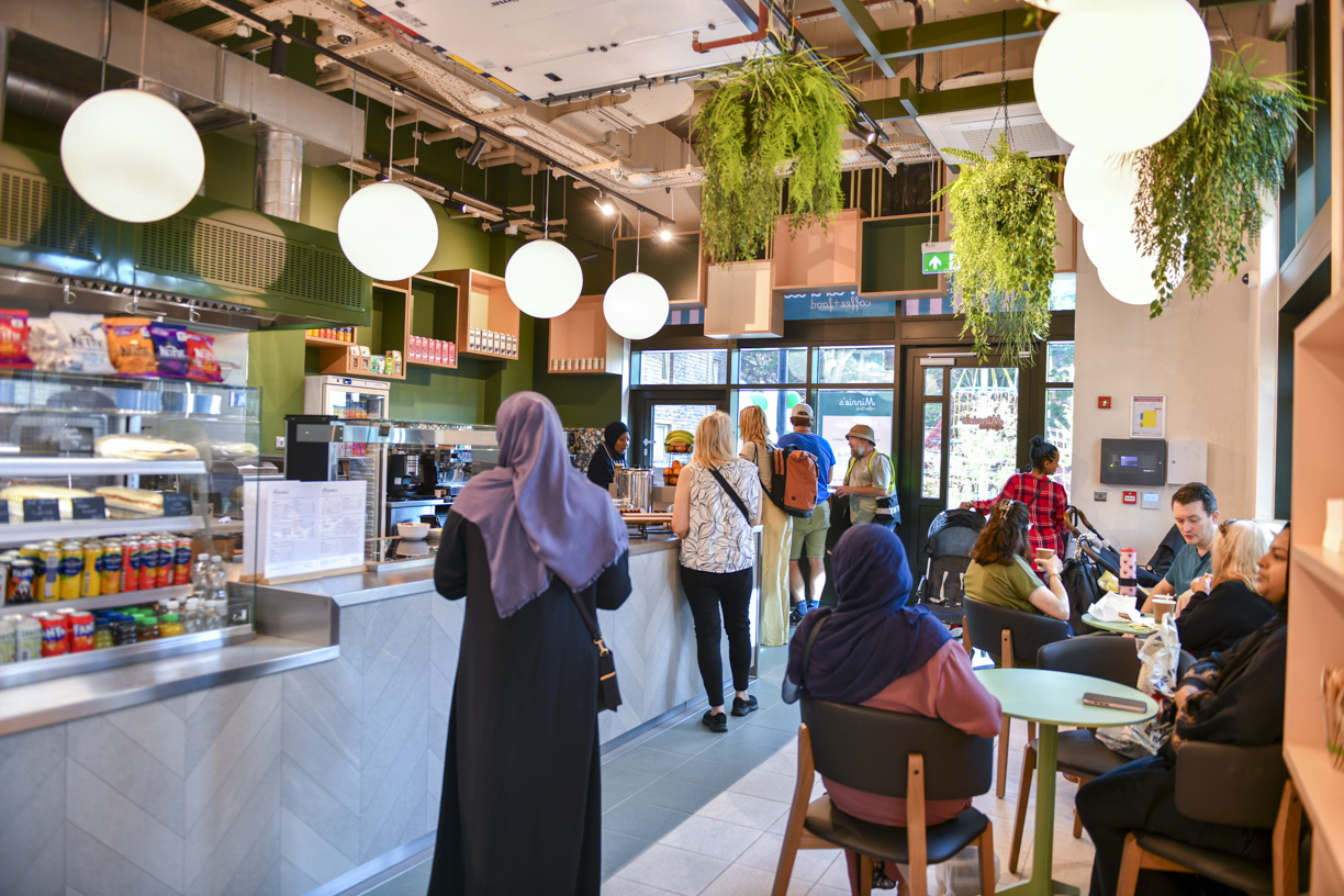 Neighbours enjoying the welcoming interior of Minnie’s café